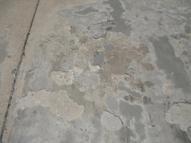 Spalling on the concrete patio. "Cicero Home Inspection"