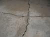 Major cracks on concrete driveway. "Worth Home Inspection Photo" 