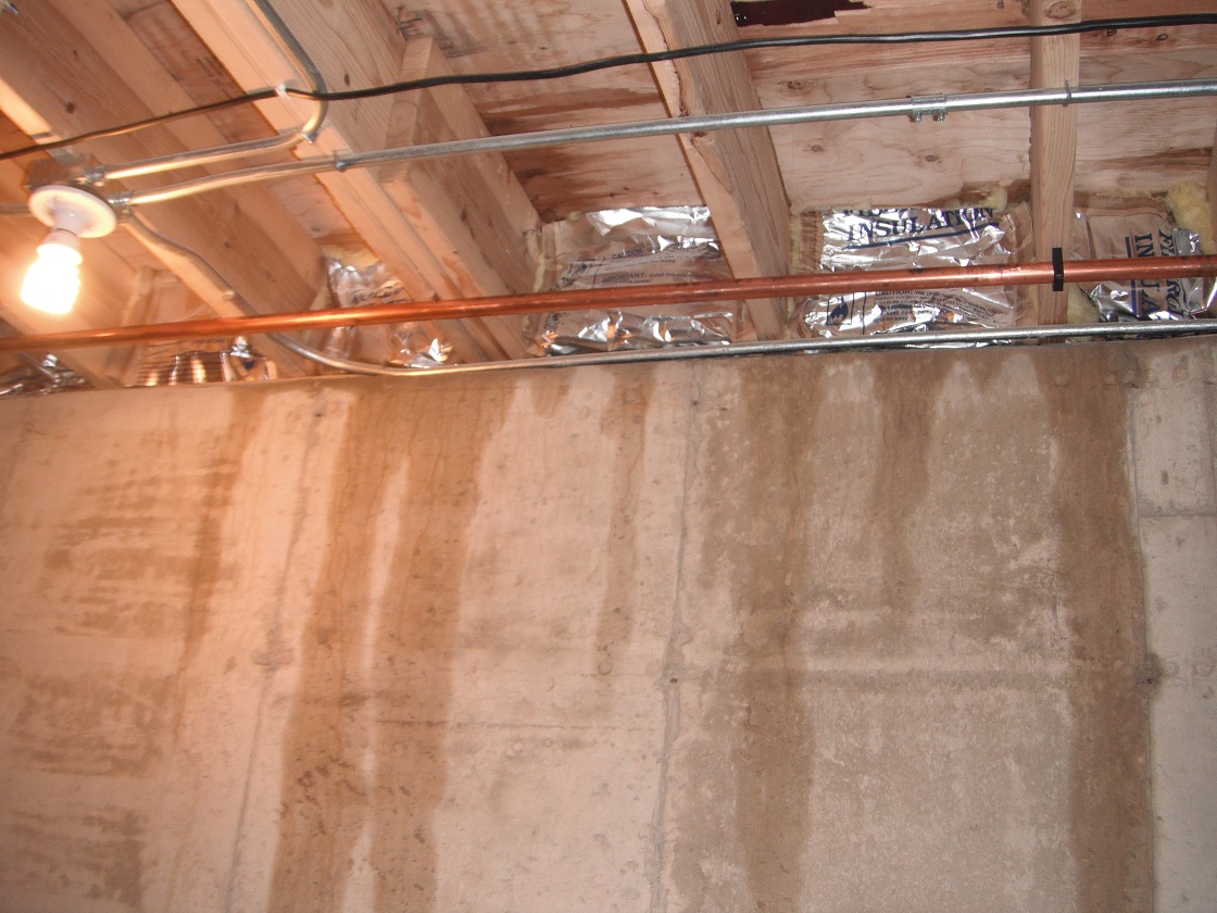 Signs of seepage above the floor joists from the exterior.  "Palos Hills Home Inspection Photo"