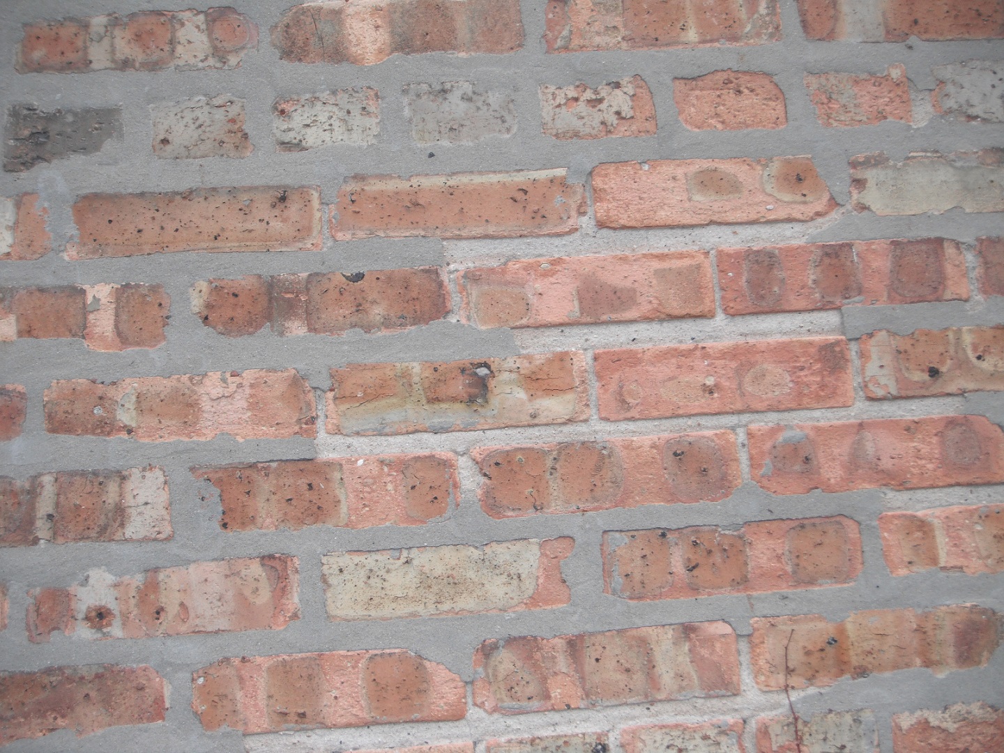 Poorly installed tuckpointing on the brick joints it is flaking off. "New Lenox Home Inspection"