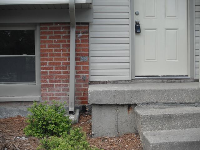 No Railngs at the front porch. Safety hazard. "Alsip Home Inspection"