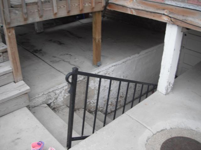 Improper and unsafe railing at exterior basement stairwell. "Tinley Park Home Inspector'