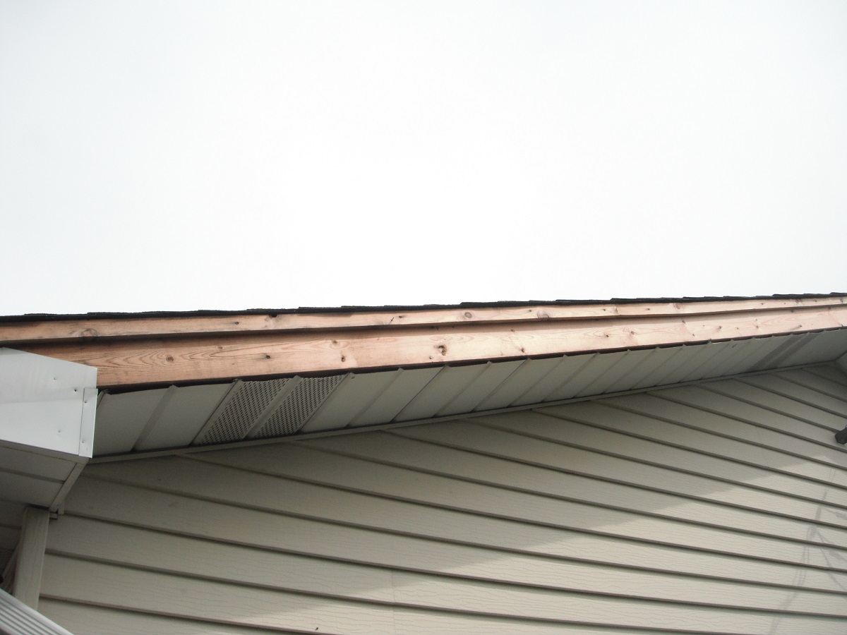 Aluminum trim missing on gable. " Channahon Home Inspection Photo"