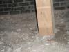 Wood Column resting on just dirt not a concrete footing like it should. "Joliet home inspection"