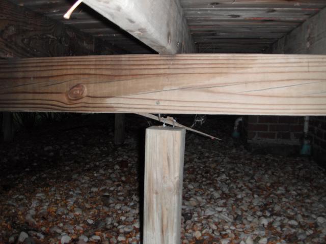 Sunken wood support column. "Lockport Home Inspection Photo"