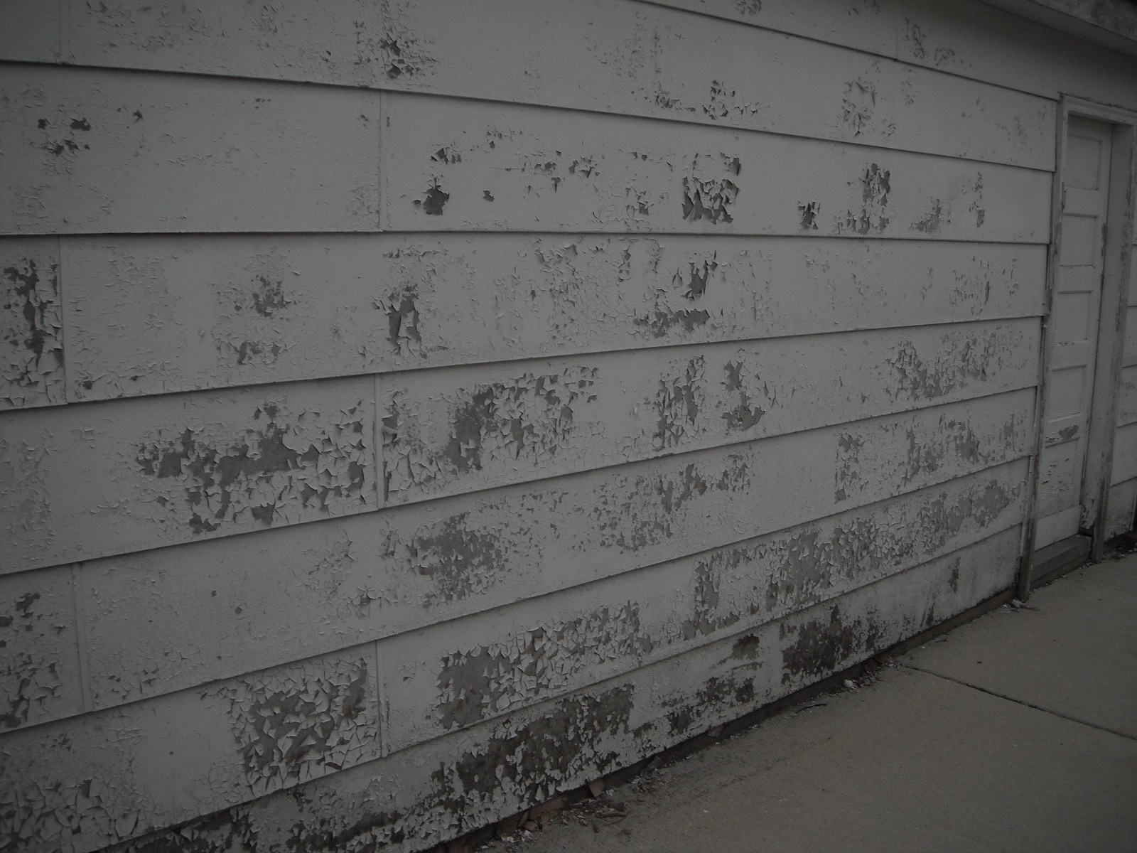 Severly peeling paint on the siding. "Oak Forest Home Inspection"