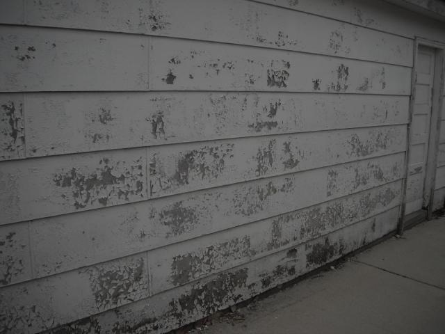 Severly peeling paint on the siding. "Oak Forest Home Inspection"