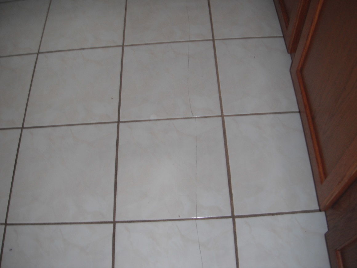 Cracked Floor tile. "Countryside Home Inspector Photo"