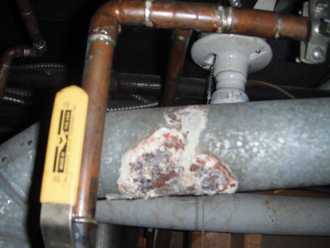 Vent pipe with corrosion on it. Potential safety hazard. "Lemont Home Inspection Photo"