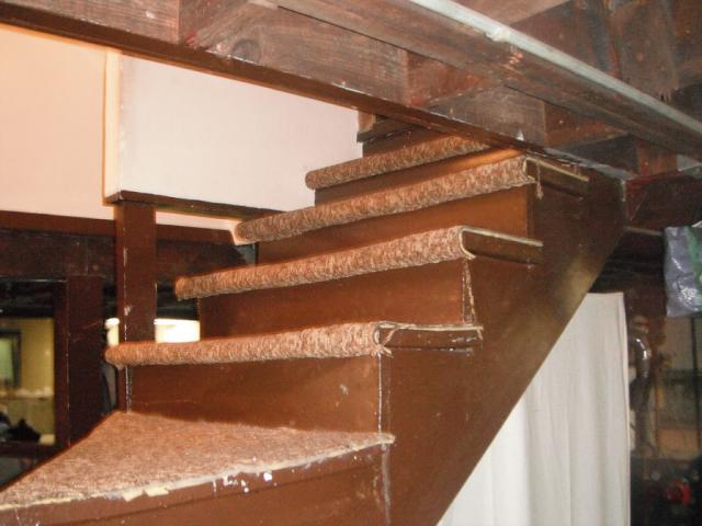 The stairs are open on both sides. Railings and spindles need to be installed for safety. "Alsip Home Inspection Photo"