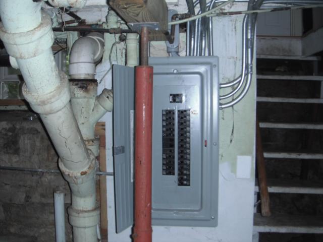 The steel column right in the way of the electrical panel. ( Cicero Home Inspection 
