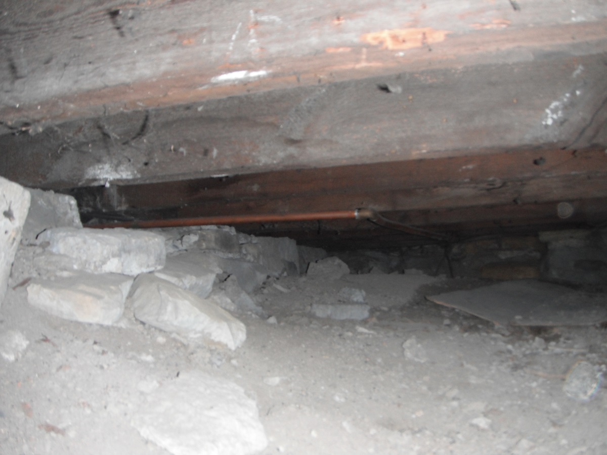 Floor joist are to close to the ground. At risk of attracting wood destroying insects. ( Lemont Home Inspection Photo)