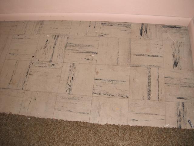 Old 9" floor tiles possibly asbestos tiles. Potential Health Hazard. "Countryside Home Inspection Photo"