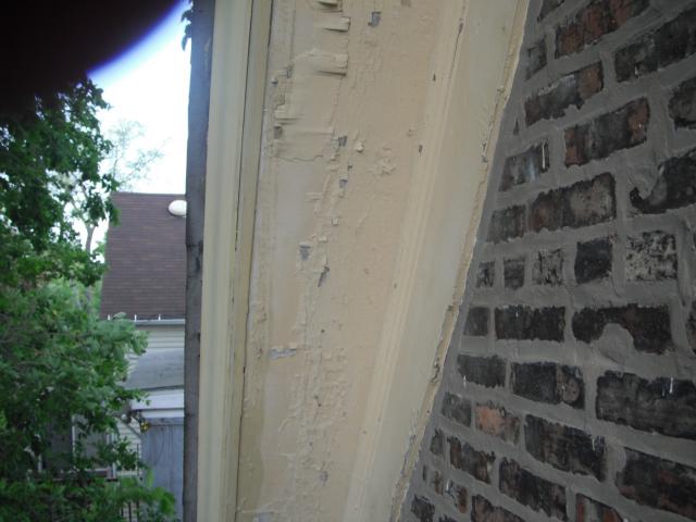 Exterior trim has severly peeling paint. Possible lead paint hazard. (Oak Lawn Home Inspection Photo)
