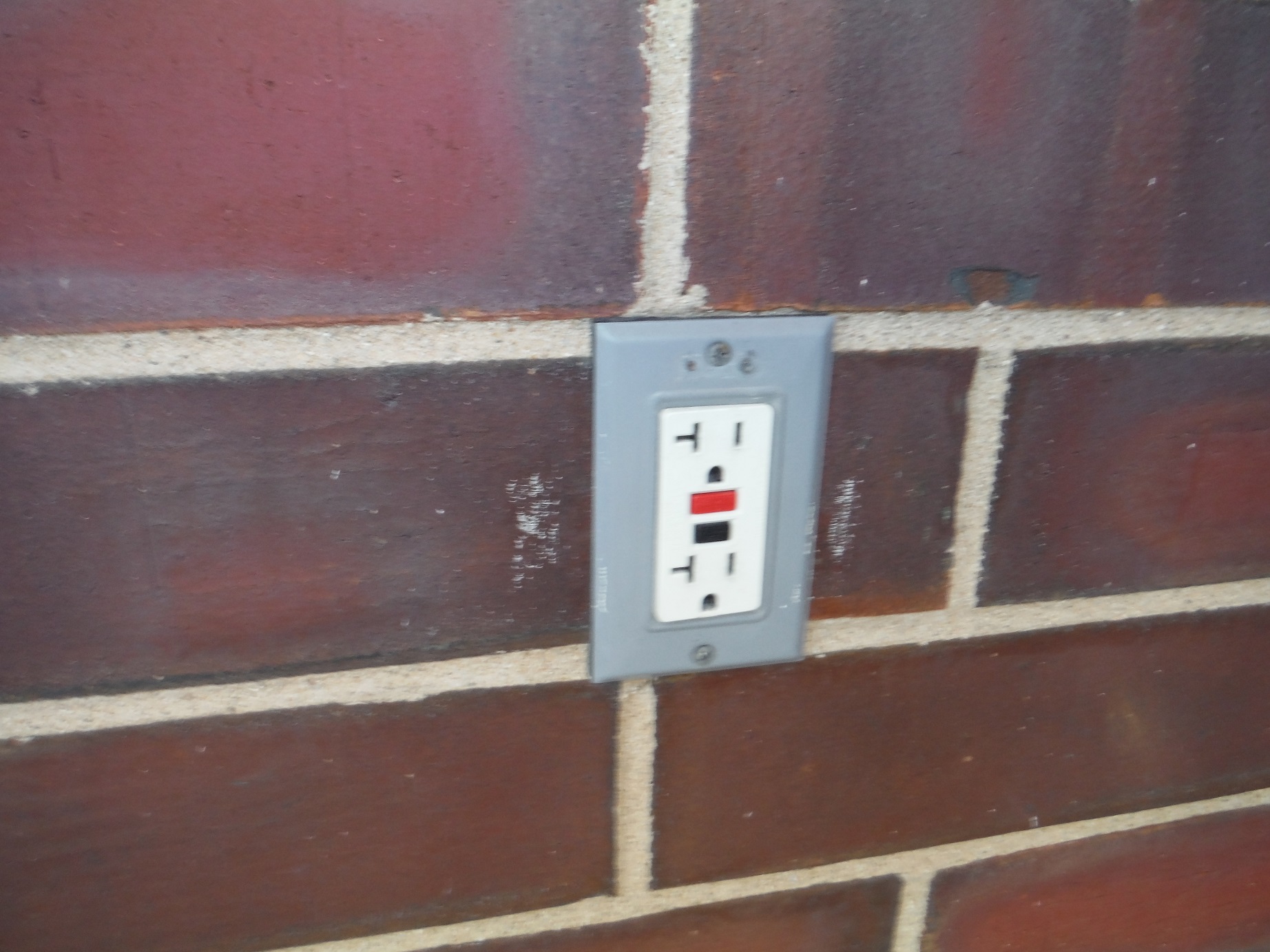 GFCI outlet is defective it doesnt trip and its missing a cover plate. Frankfort Home Inspector