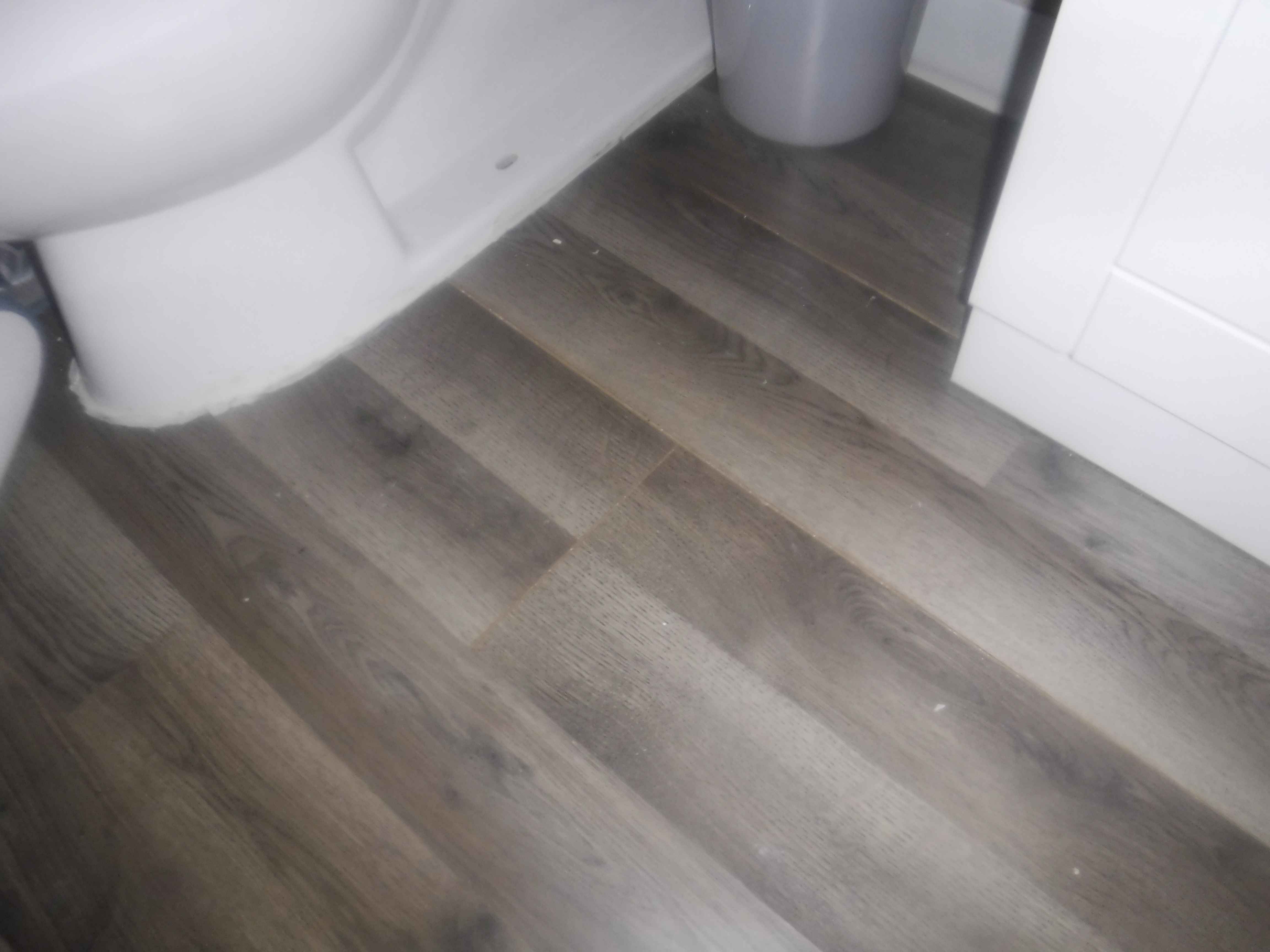 Poorly Installed laminate flooring with gaps. "Channahon Home Inspection"